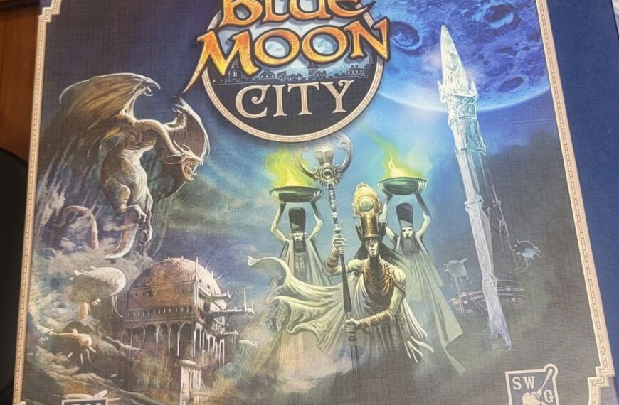 A board game box titled "Blue Moon City," featuring a fantastical illustration with a winged creature, a robed figure holding a candelabra, and an ancient cityscape, designed by Reiner Knizia. The publisher logos for CMON and SWG are visible in the corners.