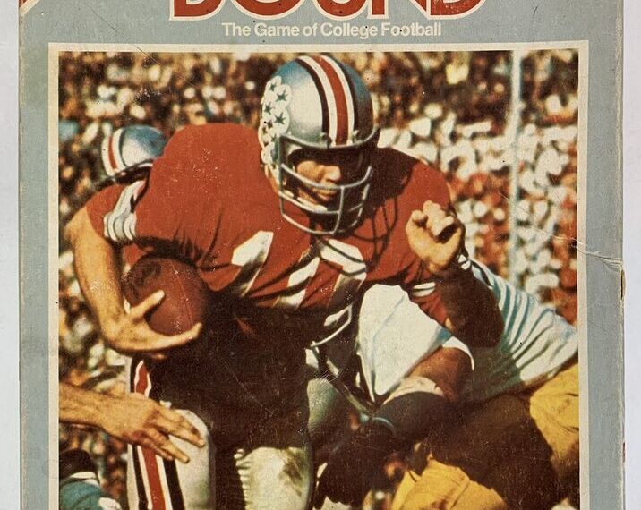 A vintage board game cover titled "BOWL BOUND" featuring an image of a college football player in a red jersey and white helmet with star decals, carrying the football while being tackled by an opponent. The background is a crowded stadium, and the game is branded as "The Game of College Football" with the "Sports Illustrated" logo at the top left.