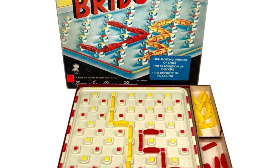 Board game "BRIDG-IT" with its box, featuring a grid playing field with red and yellow pieces, and additional pieces stored on the side.