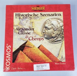 A boxed board game expansion called "Historische Szenarien für die Siedler von Catan: Alexander der Grosse & Cheops" by Klaus Teuber, with artwork featuring a coin with Alexander the Great's profile and the pyramids of Giza, produced by KOSMOS and imported by Mayfair Games Inc.