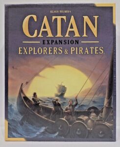 Board game "Catan Expansion: Explorers & Pirates" box cover featuring an illustration of seafaring adventurers in a rowboat with sailing ships in the background.