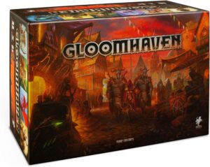 "Gloomhaven" board game box featuring fantasy artwork with armored characters and a vibrant town scene.