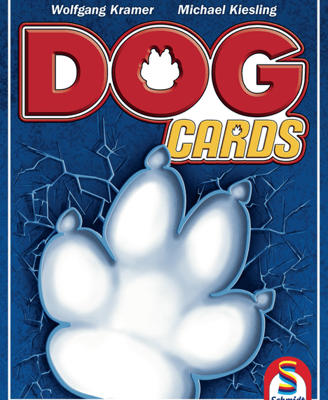 Cover of "Dog Cards" game featuring a large, white paw print on a blue cracked glass background, with the game's title in bold red and yellow letters, and names Wolfgang Kramer and Michael Kiesling at the top.