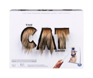 Box packaging of "The Cat Game" with the title designed with cat fur textures and an illustration of a cat holding a pencil looking to draw, indicating the theme of a drawing game featuring cats.