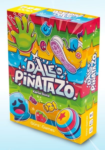 Colorful board game box titled "Dale Pinatazo" by Karla Gunz featuring vibrant cartoon graphics of a hand, shoe, and various characters.